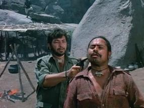 Gabbar plays 'Russian roulette' with one of his men who failed the mission.
