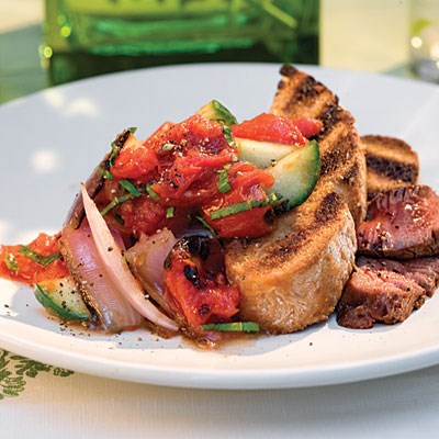 Panzanella Salad - Tomatoes, onions, cucumbers, and basil paired with grilled Italian bread make a great side to chicken or steak for your next meal.