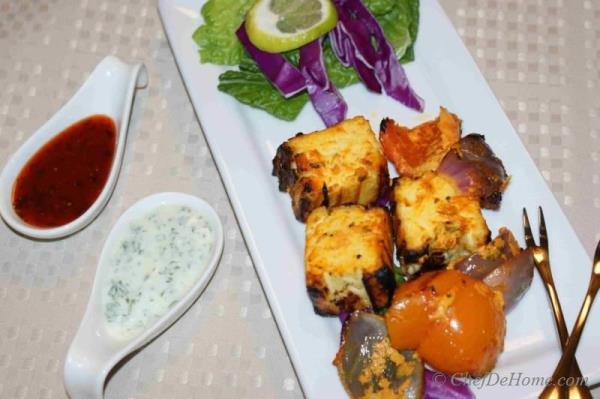 This is an easy recipe for Paneer Tikka - Paneer marinated in yogurt and spices and then grilled or baked in Conventional Oven Or traditional Indian Tandoor. 