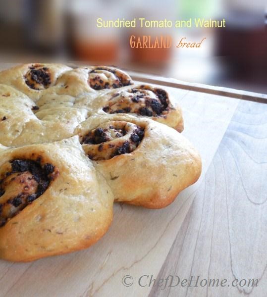 Very festive and homey, gutsy and intense flavored, this beautiful bread is a must bake for family and friends during holidays. Today, I am sharing Sun-Dried Tomato and Walnut Garland Bread. 